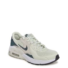 These women's Nike Air Max Excee sea glass/vinathe green/white athletic sneakers feature an iconic design with a contemporary flair. These fashion athletic shoes are crafted with mesh, synthetic and leather for long-lasting use, supportive overlays, and lace-up closure with blind eyelets for an adjustable fit. Elongated design lines and distorted proportions on the upper along with Air Unit in the heel offer a modern look. Foam midsole and foam and rubber outsole pods give lightweight comfort and durability. | Nike Women's Air Max Excee Running Shoe in Sea Glass/Vintage Green/White Size 9 Medium Fashion Athletic Shoes, Cute Running Shoes, Runing Shoes, White Athletic Sneakers, Nike Shoes Women Fashion, Nike Original, Shoes For School, Sports Outfit, Air Max Excee