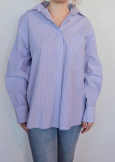 Relaxed fit button down shirt in blue and white stripe print. Size down for more of a classic fit. Details 100% Cotton Machine Washable Cold Relaxed Fit/TTS