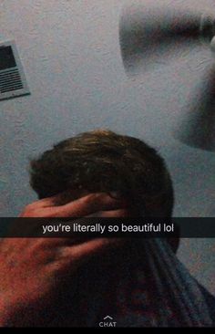 a man is holding his head in front of a fan that says, you're literally so beautiful lol