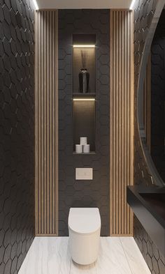 a modern bathroom with black and white decor on the walls, toilet and shelves in the corner