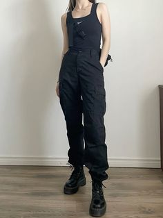 Tank top: Nike Cargo Pants: Editorial Boutique Boots: Dr. Martens Bag: FILA Dr Martens With Cargo Pants, Cargo Pants And Doc Martens, Cargo Pants And Tank Top, Cargo Pants With Boots, Combat Outfit Female, Ootd Cargo Pants, Dr Martens Bag, Cargo Pants And Boots, Nike Cargo Pants