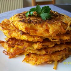 a stack of food sitting on top of a white plate