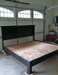 the bed frame is made up and ready to be put into place in the garage