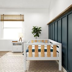 a white bed with wooden slats in a bedroom next to a window and nightstand