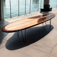 surfboard shaped solid wood coffee tables Surf Board Coffee Table, Vintage Surfboard, Vintage Surfboard Design, Painted Surfboard Fins, Surfboard Table, Teal Surfboard, Surfboard Coffee Table, Classic Surfboard, Beach House Furniture