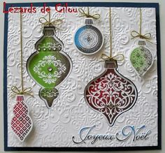 a card with ornaments hanging from it's sides