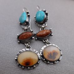 Manassas Turquoise, Sunstone and Dendritic Agate set in sterling silver.  These earrings measure slightly over 2 3/4 inches long and 3/4 inches wide at the widest point.  All components are sterling silver and have been oxidized and polished.  Each earring weighs:  10.4 grams Thanks for shopping!! Southwestern Adjustable Multi-stone Jewelry, Spiritual Multi-stone Agate Jewelry, Southwestern Multi-stone Pendant Jewelry, Bohemian Multi-stone Dangle Earrings, Silver Southwestern Multi-stone Turquoise Necklace, Southwest Jewelry, Dendritic Agate, Earrings Turquoise, Handmade Boho