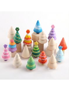 small wooden toy christmas trees on white background