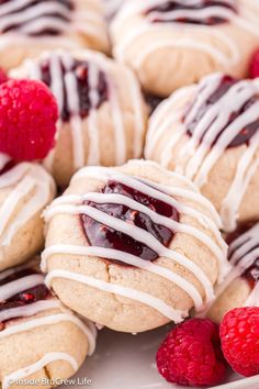 raspberry filled cookies with white icing and drizzled on top