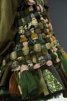 a woman's dress made out of different types of fabrics and fabric materials