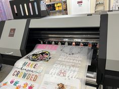 an image of a large print machine with hand prints on the front and back of it