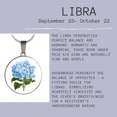 a blue hydrangea flower in a round glass pendant with the words libra on it