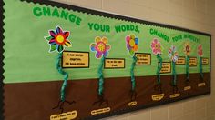 a bulletin board with flowers on it and words written in different languages that read change your words, change your minds