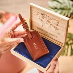 Looking for the perfect gift for someone who loves to travel? Our handmade leather luggage tag is made into a wonderful, luxurious and thoughtful gift with the addition of your unique personalisation - and the wooden gift box can be engraved with your personal message at no extra cost. The wooden box is engraved with the world map and then you can choose your message underneath. The wooden box is tied with ribbon. Each of our leather luggage tags is handmade using our signature buffalo leather a Leather Luggage Tag With Luggage Sleeve For Gift, Leather Luggage Tag With Sleeve As A Gift, Leather Luggage Tag With Sleeve For Gift, Rectangular Leather Travel Accessories Gift, Brown Leather Travel Accessories As Gift, Brown Luggage Tag For Gifts, Gift Brown Leather Luggage Tag, Brown Leather Luggage Tag Gift, Personalized Brown Luggage Tag For Gift