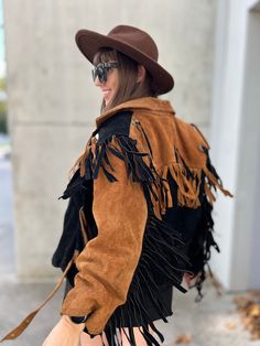 Great vintage jacket made of natural suede, decorated with fringes, in brown, red and black colors, fastened with a zipper, biker style, with a belt at the waist it is comfortable, the suede is stiffer, it fits the figure perfectly, The jacket has no defects but has traces of use, dirt and abrasions shown in the photos. the jacket looks great. It has a boho vibe :-) size from the label: L Dimensions are given in centimeters, measured flat, to obtain the circumference you need to multiply it by t Long Sleeve Leather Jacket For Fall Festivals, Fall Festival Long Sleeve Leather Jacket, Bohemian Long-sleeve Leather Jacket For Fall, Bohemian Long Sleeve Leather Jacket For Fall, Fall Festival Leather Jacket, Fall Leather Jacket With Fringe For Rodeo, Leather Jacket With Fringe For Rodeo In Fall, Western Tassel Outerwear For Fall, Bohemian Fringe Outerwear For Fall