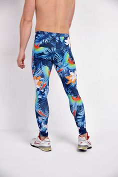 Description: Blue Jungle Print Men's Leggings Breathable & Moisture Wicking 4-Way Stretch Fabric Machine Wash Cold, Quick Drying High Stretch Nylon / Spandex Bolt Logo Patch This design does not have pockets Model is 6’2’’ (189cm) tall, 34’’ (86cm) waist and wears size Large. Blue 4-way Stretch Bottoms For Outdoor, Blue Compression Bottoms For Training, Compression Training Bottoms In Blue, Blue Elastane Training Pants, Blue Elastane Sportswear Pants, Blue 4-way Stretch Bottoms For Training, Blue Tight Sportswear Bottoms, Blue Stretch Pants For Outdoor, Blue Tight Training Pants