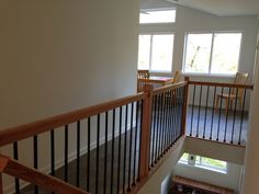 an empty room with stairs leading up to the second floor