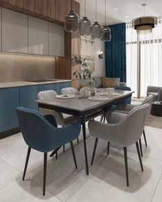 a modern dining room with blue chairs and white tile flooring