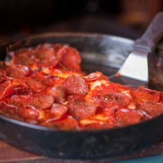 a deep dish pizza with pepperoni and cheese