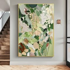 a painting hanging on the wall next to a stair case