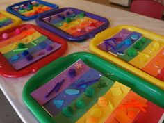 there are many trays that have different shapes and colors on them