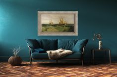 a living room with blue walls and wood flooring is pictured in this image, there are two paintings on the wall