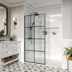 a bathroom with a sink, mirror and shower