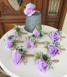 purple flowers are tied together on a table