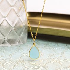 Aqua Chalcedony Gold Drop Necklace 14K Gold Filled 18 20 24 Satellite Chain Vermeil Gold Pendant - Jewelry gifts for Mom, Wife, Sister, Nana Stone: Genuine Aqua Chalcedony Please note due to nature of our genuine stones no two are alike and the ones you will receive will vary slightly from the ones pictured in the photos. Bezel: Vermeil Gold Chain: 14k Gold Filled, 18, 20 or 24 Satellite Chain, Spring Ring Clasp Gemstone: 16mm x 20mm About "Gold Filled Jewelry": Also called rolled-gold. These jewelry items are not actually filled with gold. They are made of a base metal covered by sheets of gold in a mechanical bonding process. Effectively a thick coat of gold: the industry standard for the gold content is 5% or 1/20 of the total weight. Made with 14k gold, it is hard wearing. With reasona Gold Plated Teardrop Necklace For Gift, Gold Gemstone Drop Necklace For Gift, Gold Plated Teardrop Birthstone Necklace, Gold-plated Teardrop Birthstone Necklace, Gold-plated Birthstone Teardrop Necklace, Teardrop Gold Plated Birthstone Necklace, Yellow Gold Gemstone Drop Necklace Gift, Yellow Gold Drop Necklace With Birthstone For Gift, Yellow Gold Birthstone Drop Necklace Gift