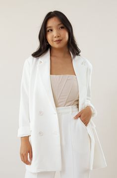 Nothing screams chic better than a matching pantsuit and blazer. Our Downtown Blazer - White is an oversized boyfriend fit blazer. Two side and double breast buttons. Match it with our Downtown Trouser to complete the look. Model wears a size small Model is 5'1" 95% Polyester, 5% Spandex Size extra small measurements: Bust: 40" Shoulder to sleeve: 24" Shoulder to hem: 27.5" Tailored White Button-up Blazer, White Double-breasted Button-up Blazer, Cheap White Button-up Blazer, Summer White Single-breasted Blazer, Chic White Single-button Blazer, Pic Pose, Fitted Blazer, White Blazer, Boyfriend Fit