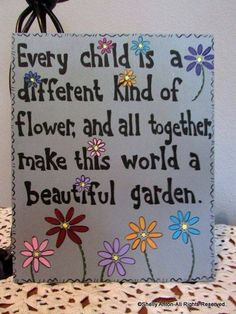 a sign that says every child is a different kind of flower and all together make this world a beautiful garden