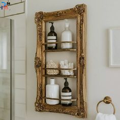 a bathroom shelf with soaps, lotion and other items on it in front of a mirror