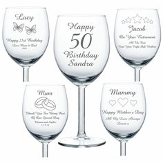 four wine glasses with the names of different wines and designs on each glass, all in white