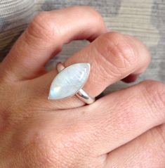 An elegant crystal white marquise or eye shaped moonstone has been set in sterling silver with a handmade ring band from sterling silver half dome wire. This moonstone is pearly white and shines on its own with varying hues of blue, pink, and slight orange (dependent on stone). The luminescent quality of the moonstone makes this ring beautifully unique and elegant. The stone is 16mm x 8mm in size with a height of about 6mm. Each stone will vary, some may have different moonstone hues (blues and Silver Marquise Moonstone Ring, Western Rings, June Birthstone Ring, Moonstone Ring Sterling Silver, Ring Marquise, Marquise Ring, Crystal White, November Birthstone, June Birthstone