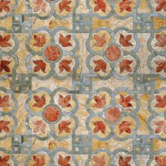 an artistic tile design with leaves and circles