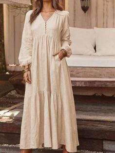 Non-stretch Long Sleeve Maxi Beach Dress, Non-stretch Long Sleeve Maxi Dress For Beach, Beige Long Sleeve Boho Beach Dress, Beige V-neck Cotton Maxi Dress, Beige Boho Dress For Fall Vacation, Cotton Maxi Dress For Fall Beach Outings, Cotton Maxi Dress For Fall Beach, Beige Cotton Maxi Dress With V-neck, Cotton Maxi Dress For Beach In Fall