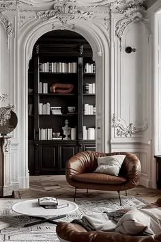 a living room filled with furniture and bookshelves