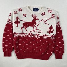 a red and white sweater with reindeer on it