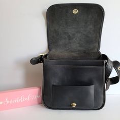 "Vtg Classic Coach NYC Stewardess Bag Navy leather (almost black) with brass hardware Roomy interior with inner zip pocket, outer full slip pocket and a small slip pocket Covered by a flap and secured with a turnlock Original hangtag and chain Adjustable 31\" strap at longest Measures: 11\"L, 11\"H, 3\"W Made in New York, USA #384-3612 Cleaned, conditioned and ready to wear! Questions? Just ask More vtg coach styles/colors also available G144" Black Satchel With Brass Hardware For Everyday, Classic Shoulder Bag With Pockets For Daily Use, Everyday Black Satchel With Brass Hardware, Classic Satchel Shoulder Bag With Pockets, Vintage Crossbody Satchel With Pockets, Black Leather Shoulder Bag With Coin Pocket, Classic Crossbody Bags With Pockets, Black Satchel With Brass Hardware For Travel, Classic Black Shoulder Bag With Pockets