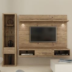 a living room with a tv and entertainment center