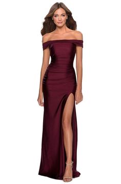 Look like that unforgettable sight that everybody will be talking about in this fabulously rendered La Femme 28506 Evening Gown. This fitted floor length gown is flexible in solid jersey fabric, with an off shoulder neckline and low-cut open back with crisscross tie details. The bodice is encased with fine ruching while the long skirt flaunt a wide thigh-high leg slit. This La Femme design is an outstanding choice for your next formal event when you dare to draw attention. Find more formal dress Formal Full-length Ruched Evening Dress, Formal Full Length Ruched Evening Dress, Formal Ruched Full-length Evening Dress, Fitted Full Length Ruched Evening Dress, Full Length Evening Dress With Ruched Bodice For Prom, Fitted Off-shoulder Gown With Pleated Bodice, Full Length Gown With Ruched Bodice, Full Length Gown With Ruched Bodice For Gala, Full-length Gala Gown With Ruched Bodice