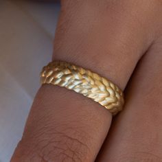 A beautiful 14K solid gold braided wedding ring, the perfect woven texture promise ring. In exquisite ring,Each turn and twist in the gold echoes the ancient tradition of weaving, a meticulous process that transforms simple strands into complex, beautiful patterns full of depth and meaning. Materials & Measurements: ✤ 14K/18K solid yellow/white/rose gold ✤ The ring's width: 0.24" (6mm) ✤ Packed in a luxurious gift box ✤ Fully Insured And Discreetly Packaged Shipping: ✤ Free worldwide shipping. ✤ Braided Wedding Ring, Braided Wedding Rings, Ring Texture, Braid Wedding, Celtic Wedding Rings, Celtic Wedding, Braided Ring, Solid Gold Ring, Etsy Wedding Rings