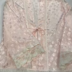 Reasonable Offers Will Be Considered Vintage Christian Dior Night Gown Bed Jacket In Light Pink Floral Pattern In The Fabric With Lace Trimmed And Few Pearls Beads With Satin Bows On Each Side Of The Sleeves Laces. 100% Polyester Hand Wash With Cold Water Size : S Reasonable Offers Welcome No Return Accepted Elegant Pink Sleepwear For Loungewear, Elegant Pink Nightgown For Loungewear, Feminine Lace Sleepwear, Elegant Long Sleeve Robe For Sleepover, Pink Delicate Lace Sleepwear, Elegant Pink Nightgown, Elegant Pink Long Sleeve Sleepwear, Elegant Pink Sleepwear For Sleepovers, Elegant Pink Sleepwear For Wedding Night