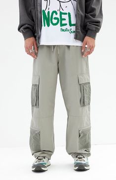 The Shadow Baggy Cargo Pants from PacSun offer a relaxed fit with wide legs, crafted from a durable cotton-nylon blend. Featuring a drawstring waistline, reinforced seams, side entry pockets, and cargo pockets with zipper details, these pants seamlessly blend practicality with contemporary style.


	Drawstring waistline
	Side pockets
	Welt back pockets
	Relaxed fit
	Cargo pockets with zip detail
	30" Inseam
	19.5" Leg opening
	Rigid
	66% Cotton, 34% nylon
	Machine washable
	Measurements taken from a size medium
	Model is wearing size medium
	Model Measurements: 6'2” Height, 30” Waist, 32” Inseam Relaxed Fit Cargo Parachute Pants, Techwear Wide Leg Parachute Pants With Patch Pockets, Relaxed Fit Full Length Parachute Pants With Pockets, Green Wide Leg Parachute Pants With Patch Pockets, Outdoor Cotton Cargo Parachute Pants, Khaki Utility Parachute Pants With Loose Fit, Streetwear Full Length Parachute Pants With Patch Pockets, Streetwear Full-length Parachute Pants With Patch Pockets, Khaki Cargo Jeans With Elastic Waistband