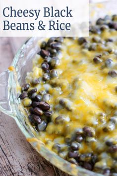 a cheesy black beans and rice casserole in a glass baking dish