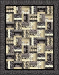 a black and white quilt with lots of different patterns on it's sides, including squares