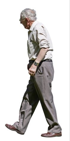 an old man walking with his hands in his pockets