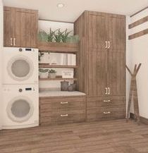 a laundry room with washer and dryer in the corner, next to cabinets