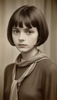 a black and white photo of a woman with short hair wearing a scarf around her neck