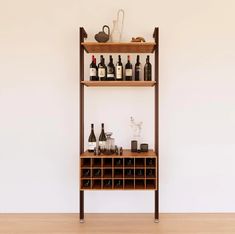 a wooden shelf with bottles and glasses on it